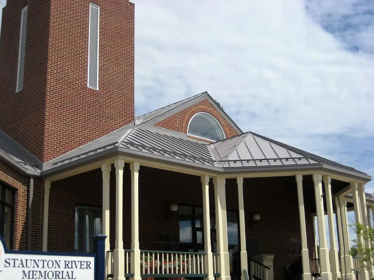 Skilled roofing craftsmen working on a residential roof in Braintree
